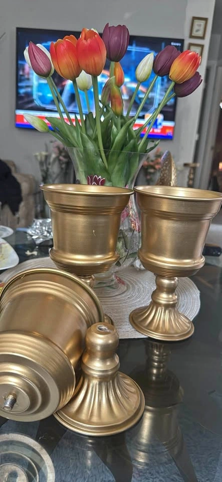 Golden metal pedestal vase