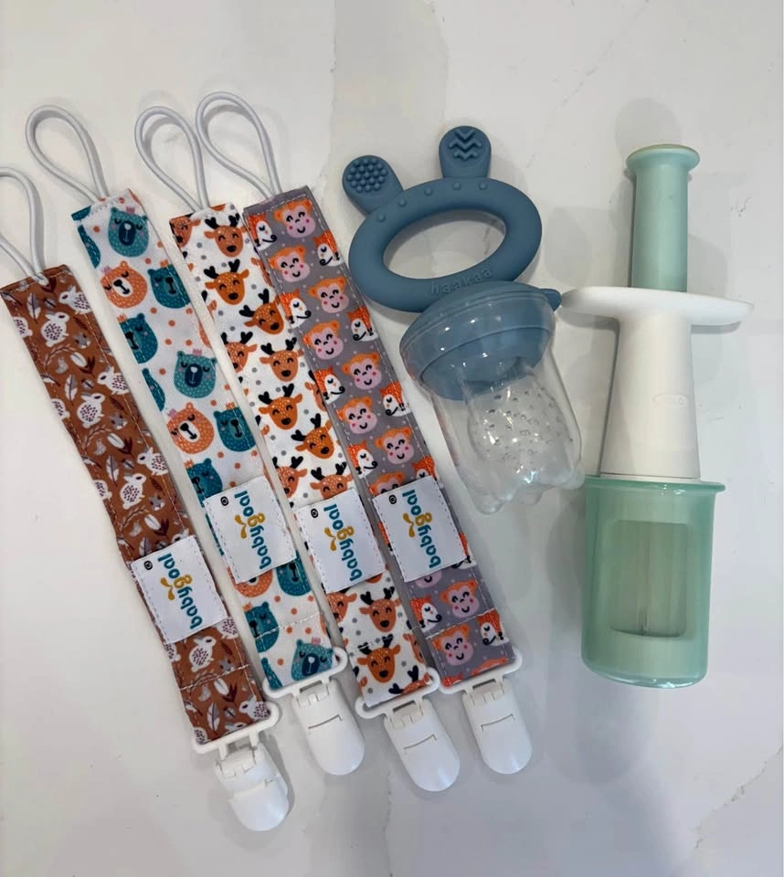 Baby items (pacifier clips, haakaa food feeder, OXO grape cutter