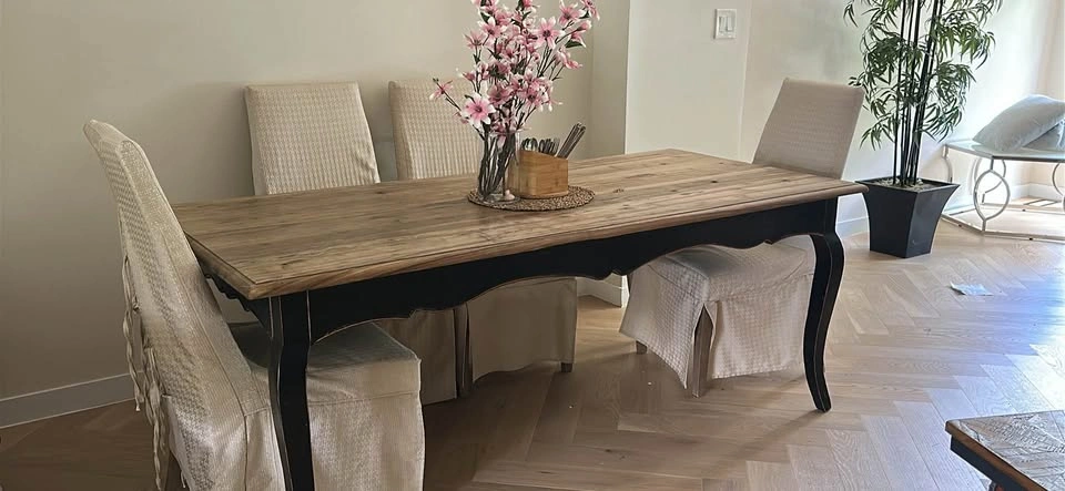 Wooden table with four dining chairs (including the chair covers