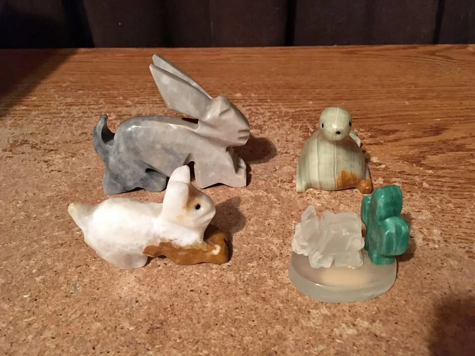LOT OF 4 ONYX ALABASTER FIGURES RABBIT SEAL DONKEY AND CACTUS
