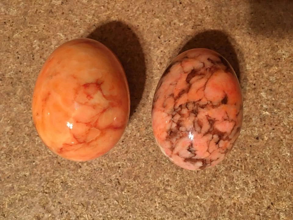 LOT OF TWO VINTAGE PINK/ORANGE ALABASTER MARBLED STONE EGGS