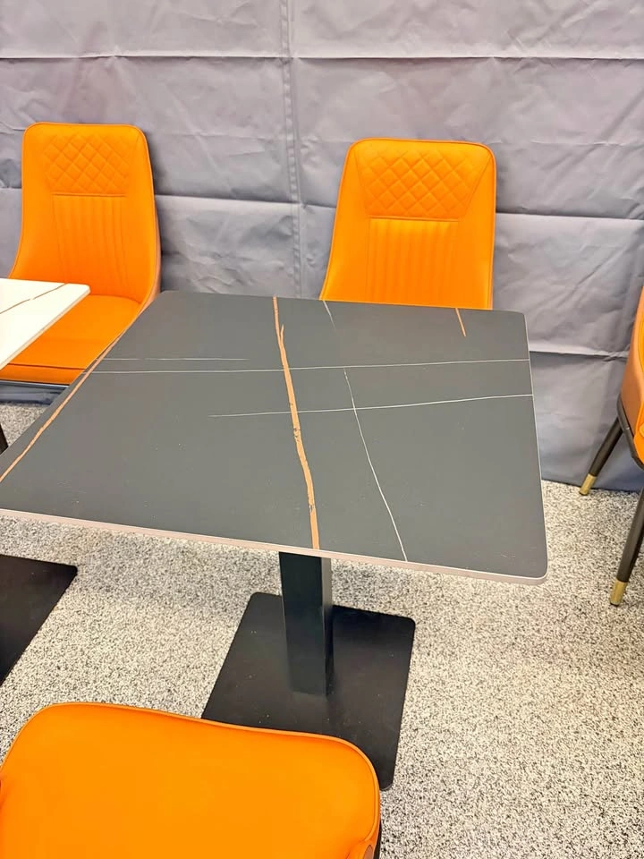 Restaurant table, brand new, stone top with steel base. $150