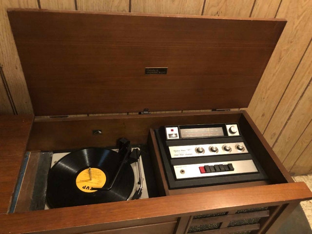 Vintage record player in side table