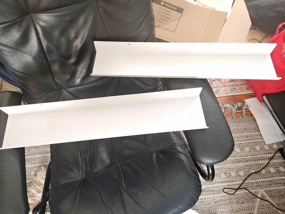2 white metal shelves