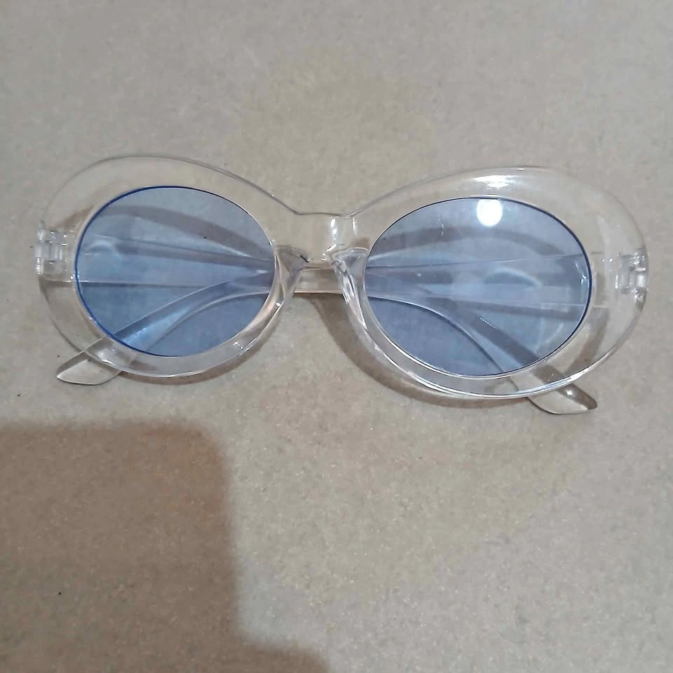 ⚽ Clear Oval Sunglasses with Blue Lenses