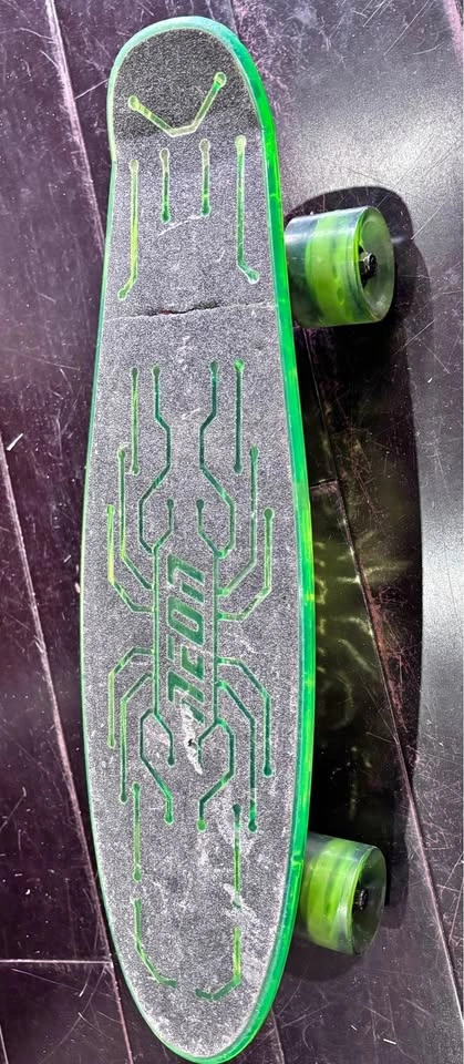 Yvolution Neon Hype green skateboard featuring light-up deck