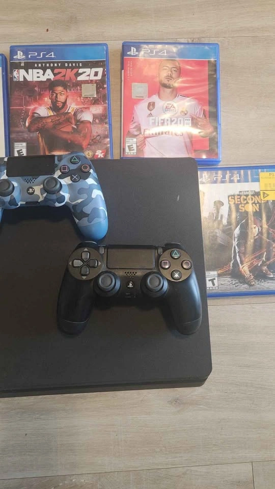 PS4 1 TB with 2 controllers and games - photo 2