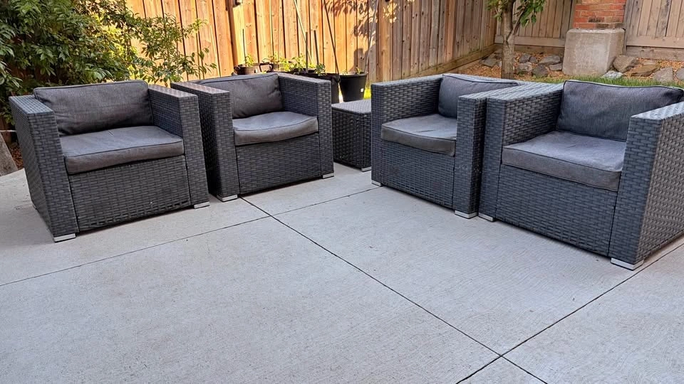 4 dark grey wicker patio chairs and side table