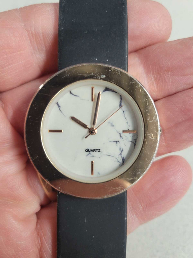Ladies copper color and marble dial watch. A really looker.