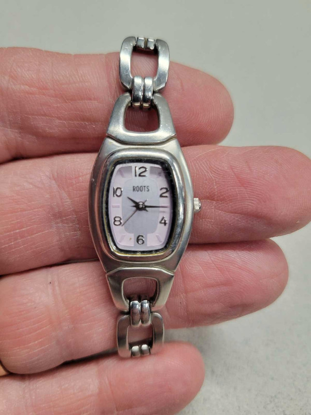 Ladies Irrestible ROOTS watch, silver and pink dial.