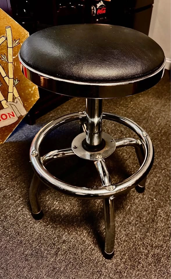 Nice black steel spin and height adjustment stool with foot rail