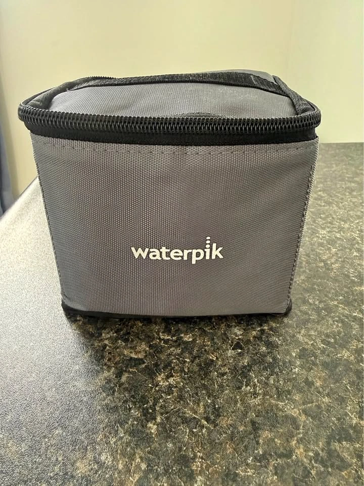 Travel size waterpik and travel case