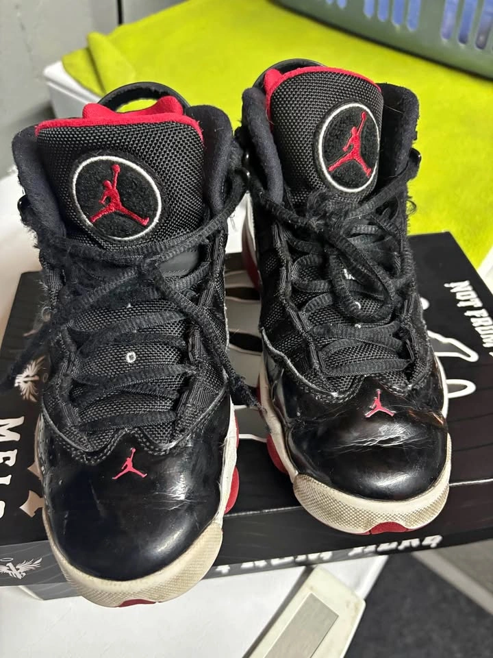 M J's black and red sneakers boys