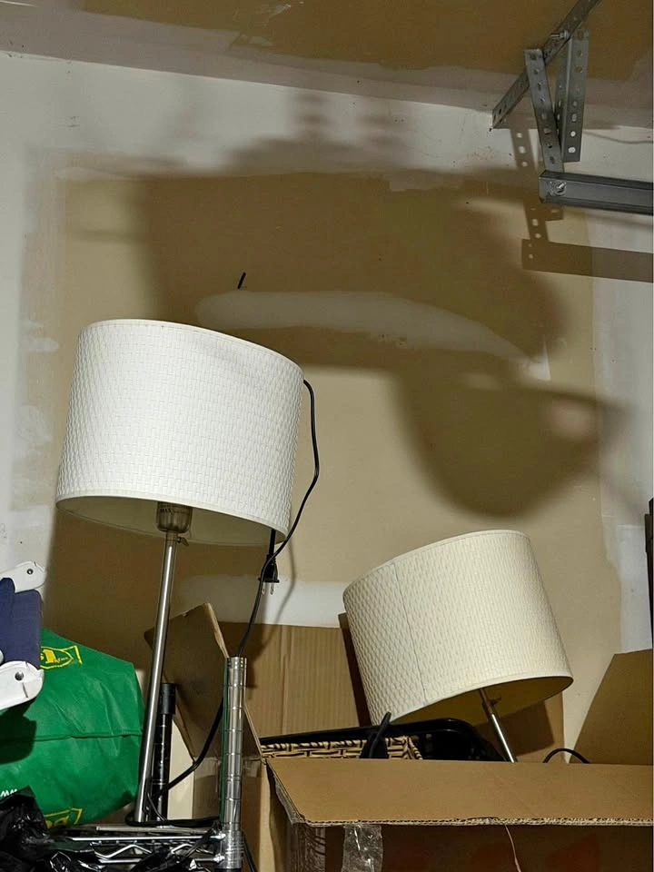 Two white shade floor lamps