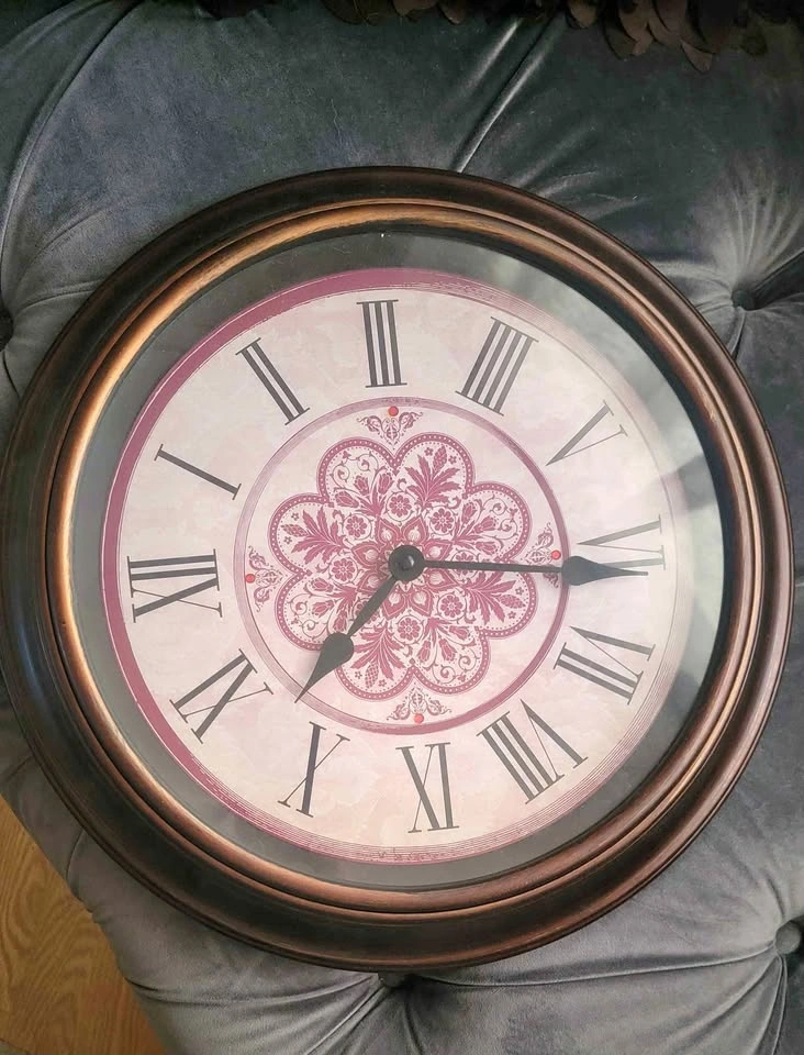 Bronze wall clock with roman numerals