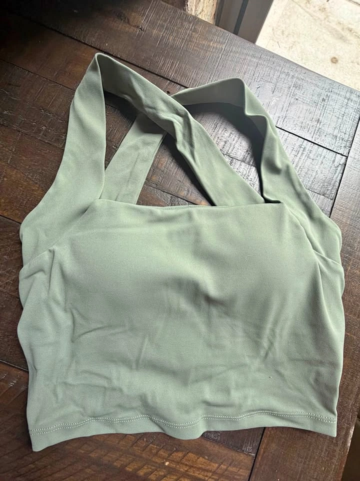 New in bag. Green bra top with shelf bra and padding!
