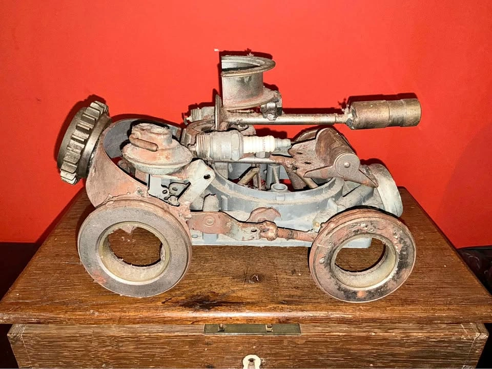 Rusted-metal and sparkplug art piece