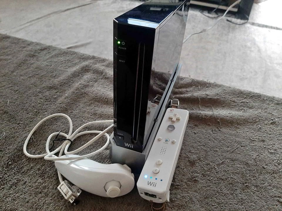 Black Nintendo Wii Console with Controllers and Cords