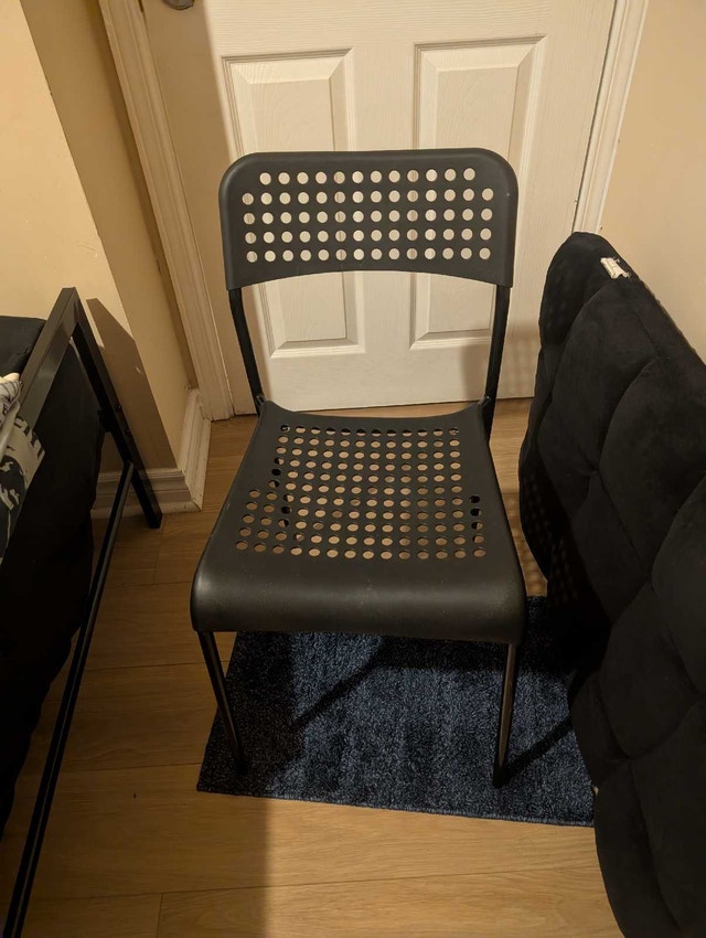 IKEA chair (black plastic with holes)
