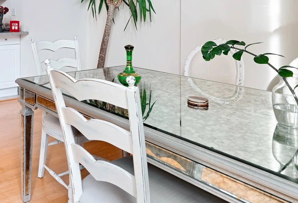 HORCHOW: Antique glass dining table