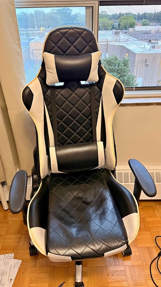 Gaming chair with adjustable height and arm