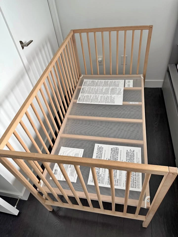 Ikea Crib, mattress, mattress protector and brand new bedsheet