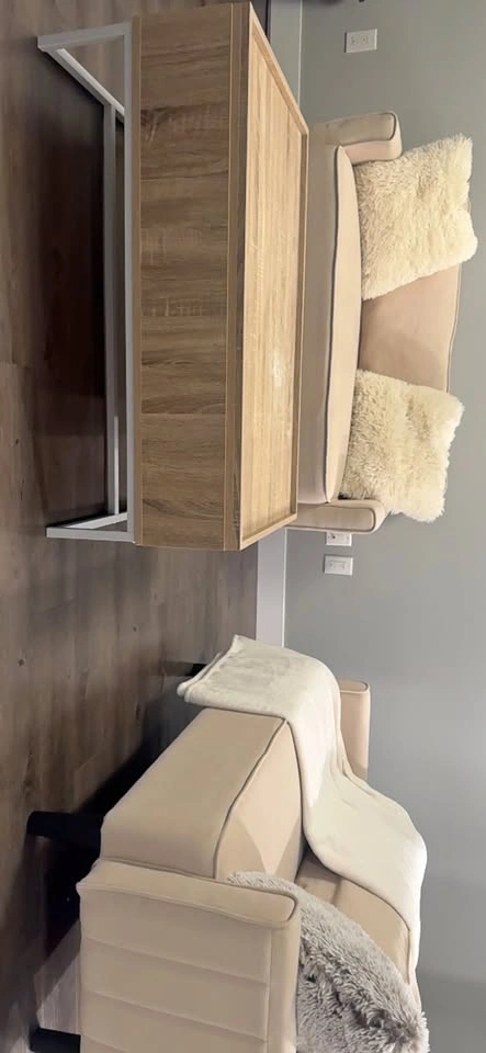 2 beautiful couches and a wood and Metal Table