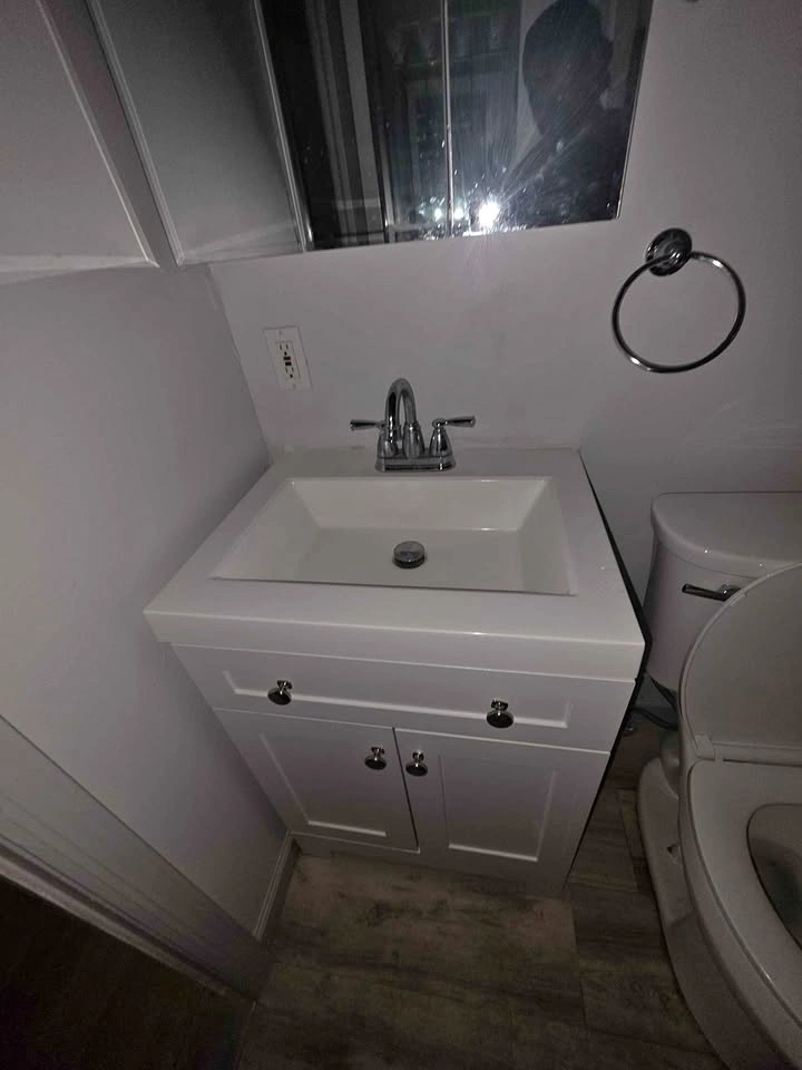 White Bathroom Vanity with Chrome Faucet