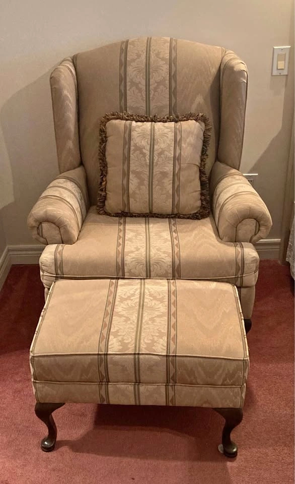 Winged armchair and foot rest