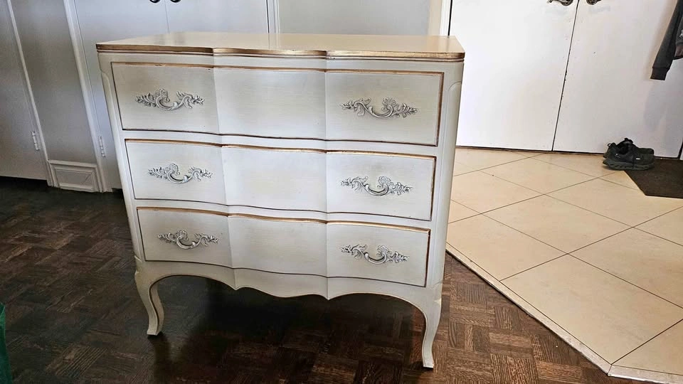 Beautiful solid wood 3 drawer dresser. Off-white with gold trim.