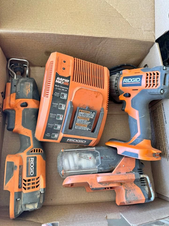 Assorted Ridgid Tools: Saw, Charger, Drill, and Work Light