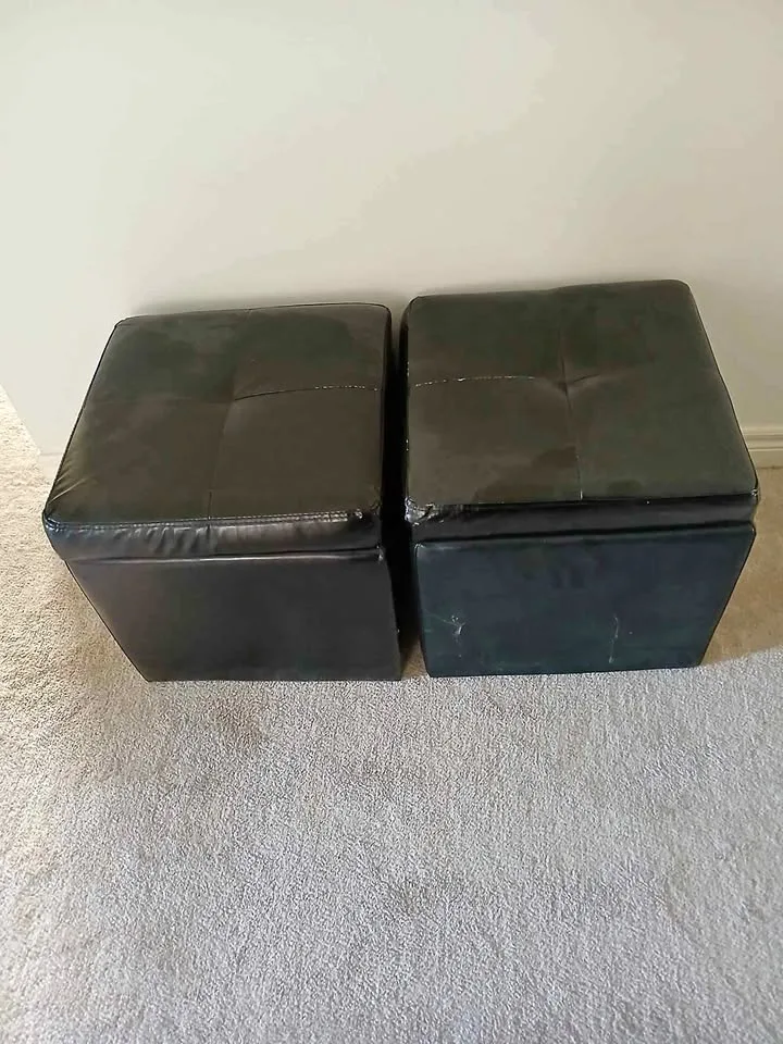 2 black Ottomans with storage