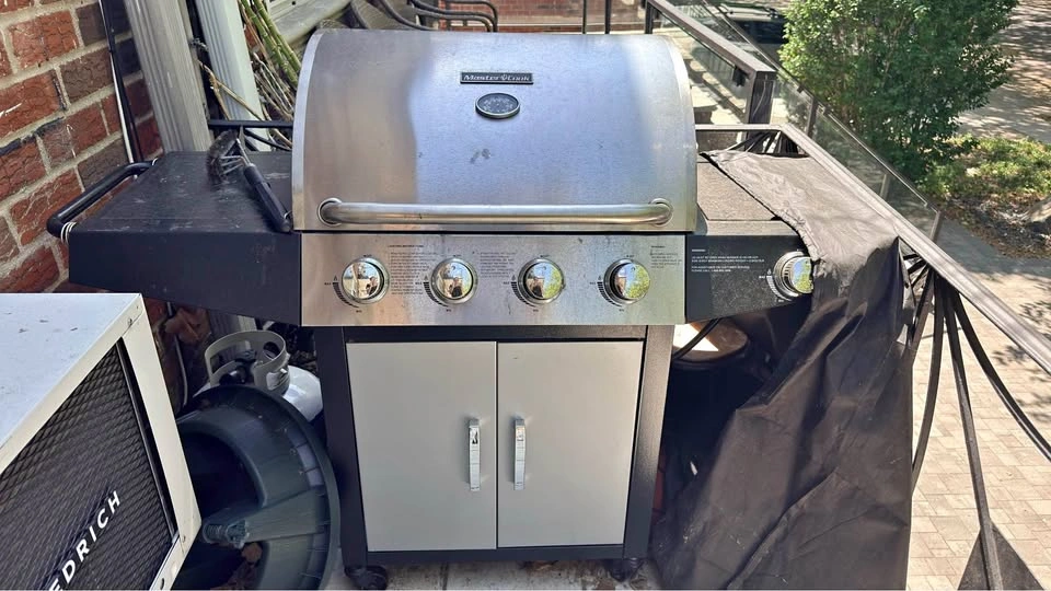 Grill with cover, propane, 3 outdoor chairs, and table