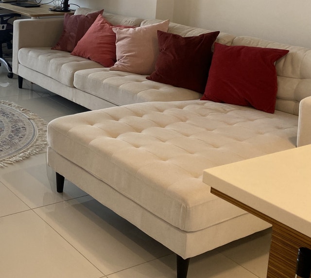 Beautiful cream L-shaped sectional sofa in excellent condition