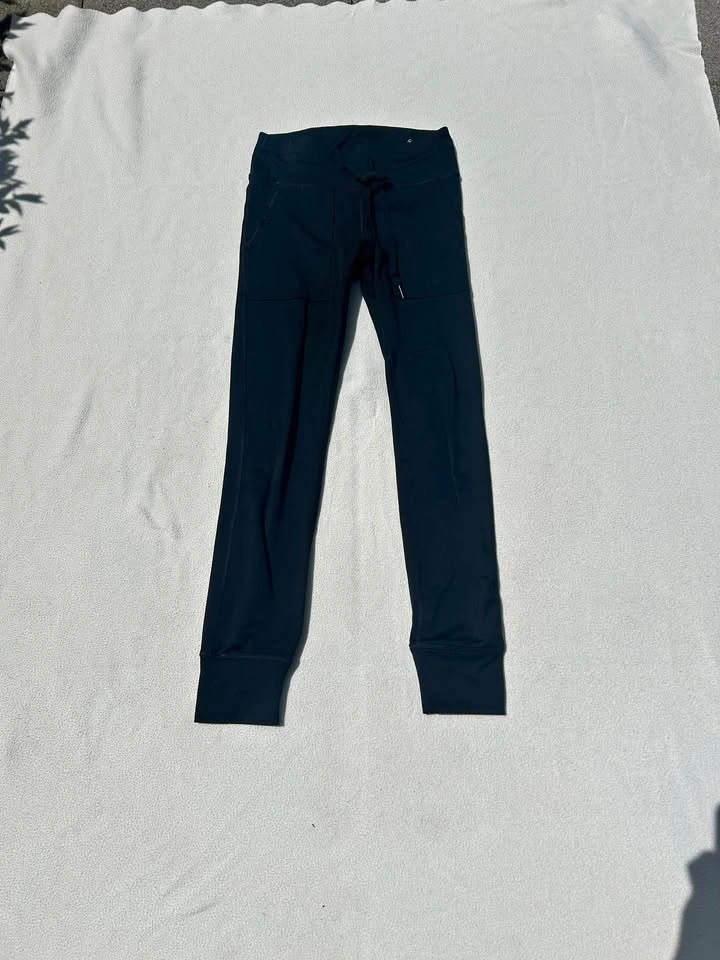 Two black pants both fit same size