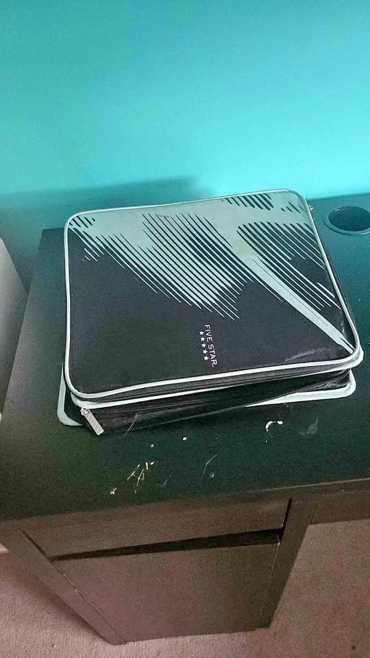 Teal and black binder