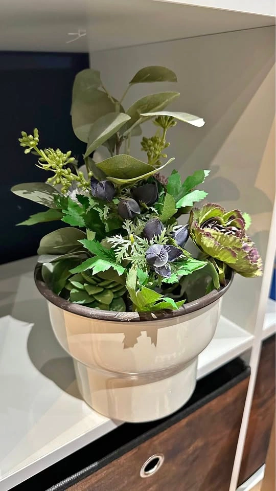Artificial flowers with a vase