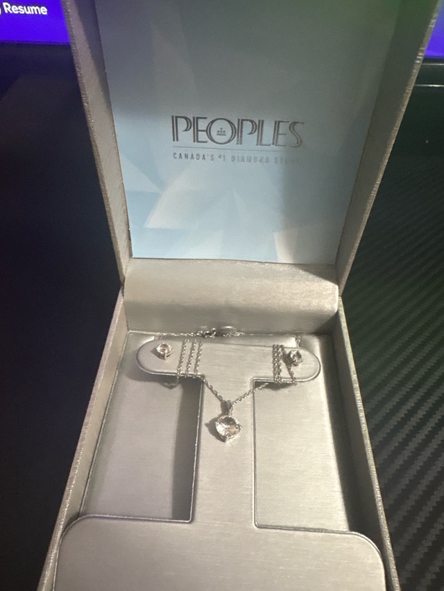 Sterling silver with small stones likely Diamonds