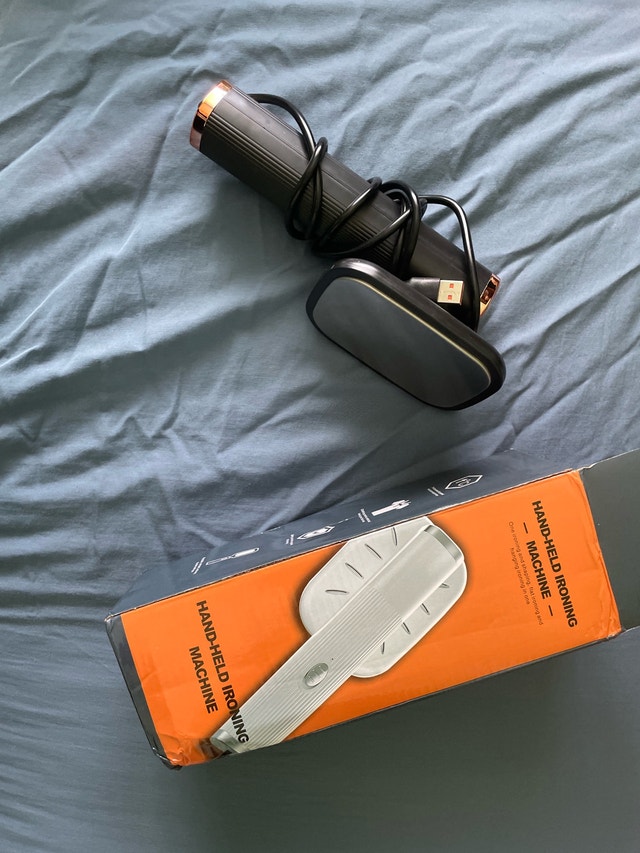 Hand-Held Ironing Machine