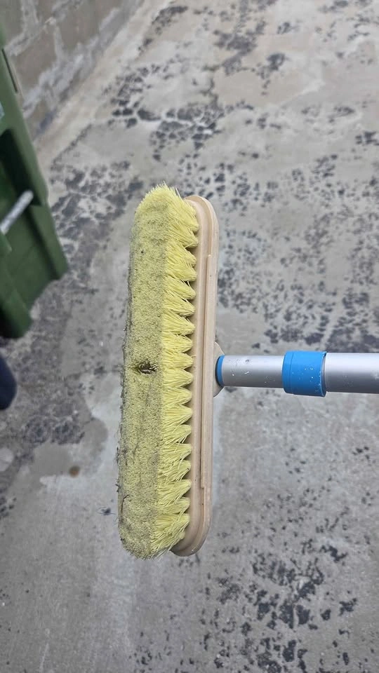 Deck brush with water outlet connection for rent