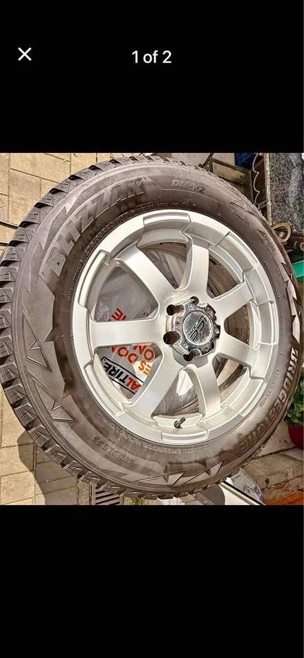 4 Bridgestone Blizzak DM-V2 Winter Tires on Alloy Rims