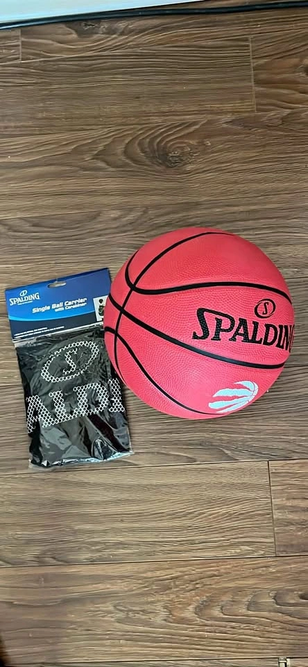 Spalding basketball and ball carrier