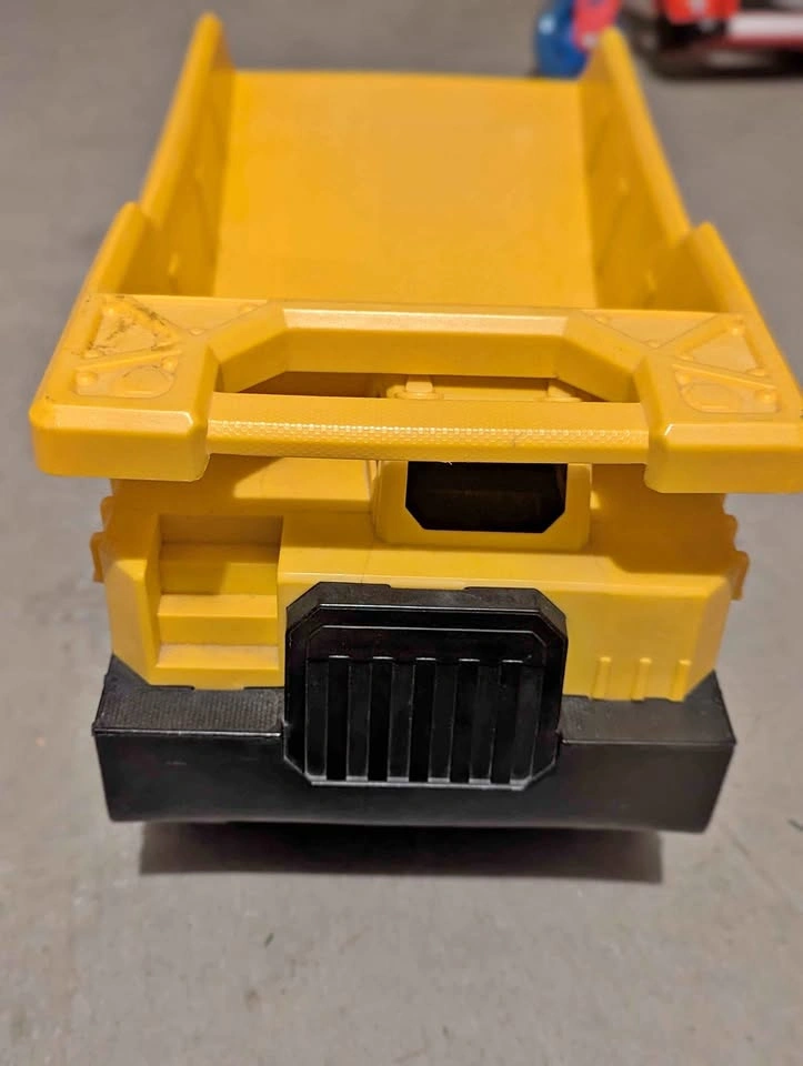 2 Outdoor dump trucks - 1 Tonka Steel Dump Truck, 1 CAT plastic