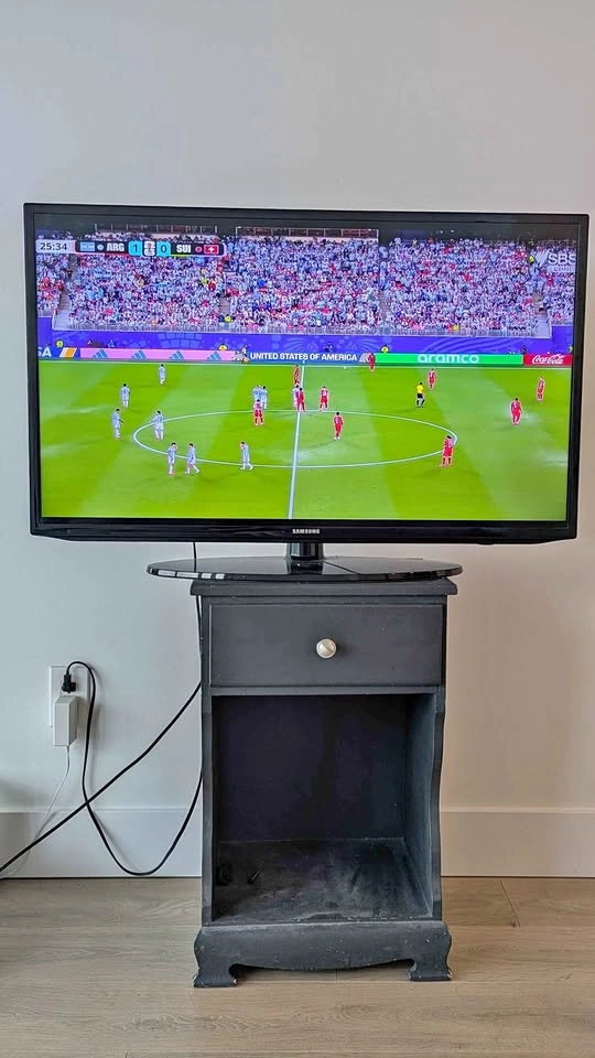 Samsung TV and Black Media Stand