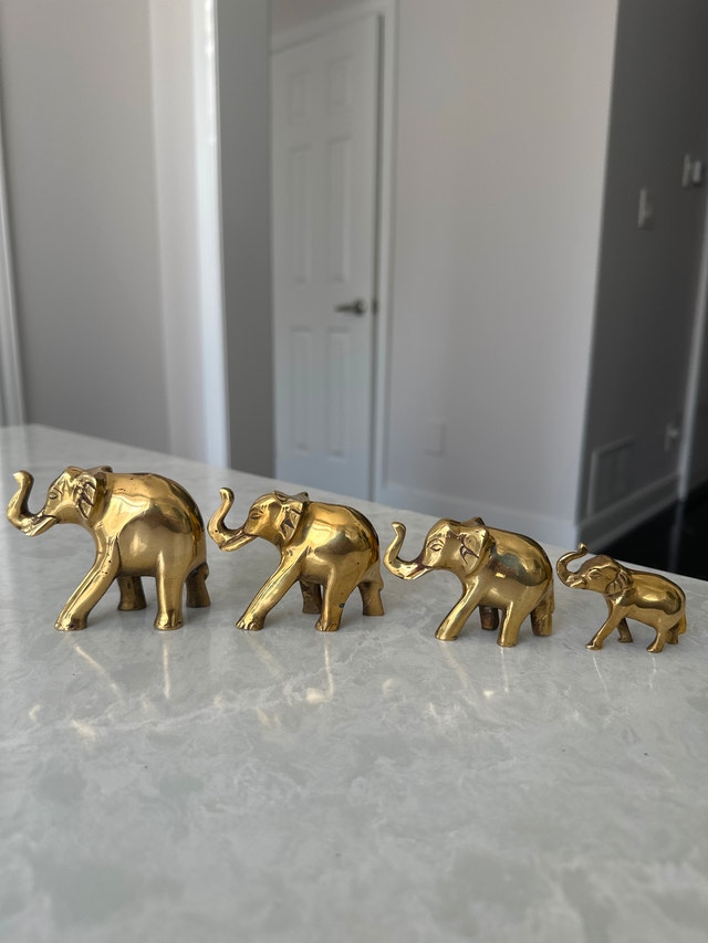 Solid brass vintage elephant figurines. Set of four.