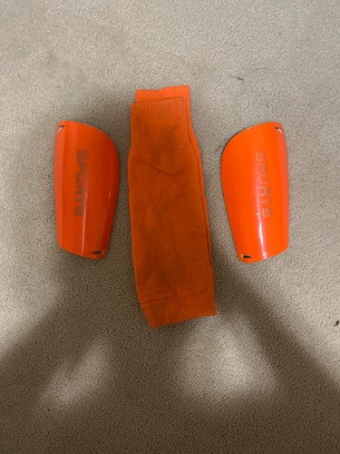 orange shin guards
