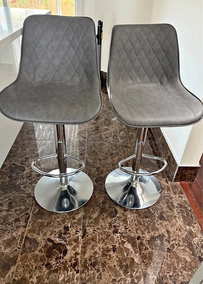 Pair of Diamond Stitched Swivel Bar Stools