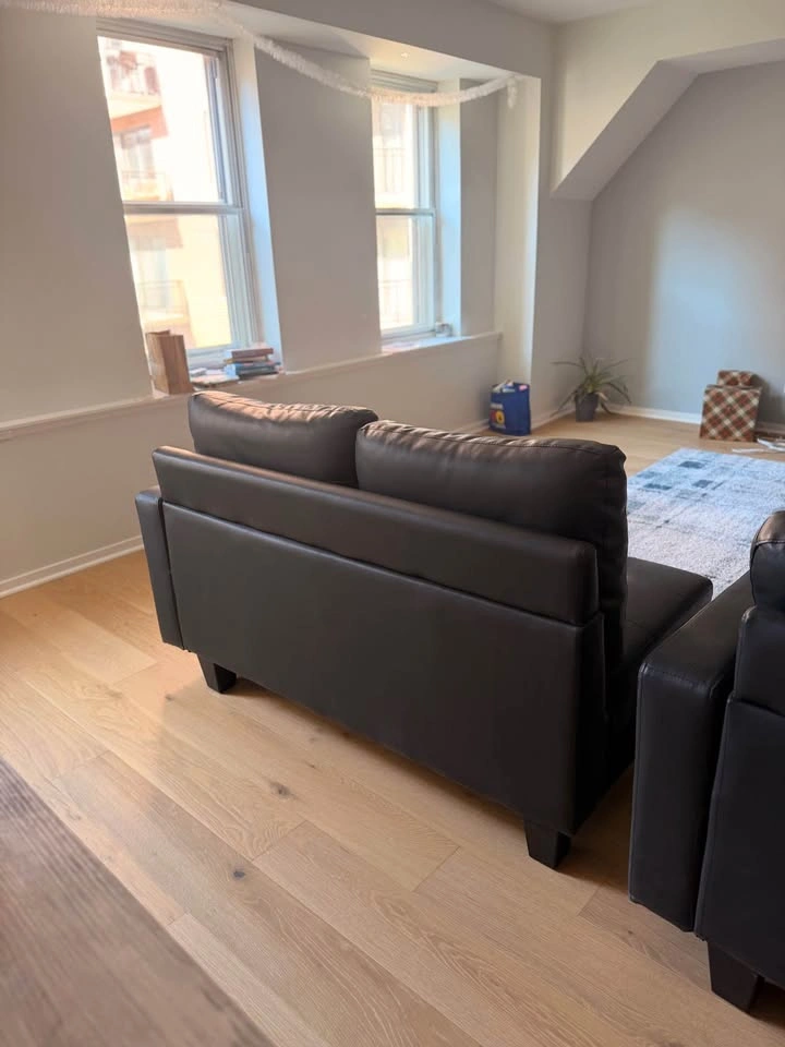 MOVING: Black Leather Couch w/ Ottoman - photo 3