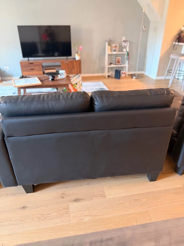 MOVING: Black Leather Couch w/ Ottoman - photo 4