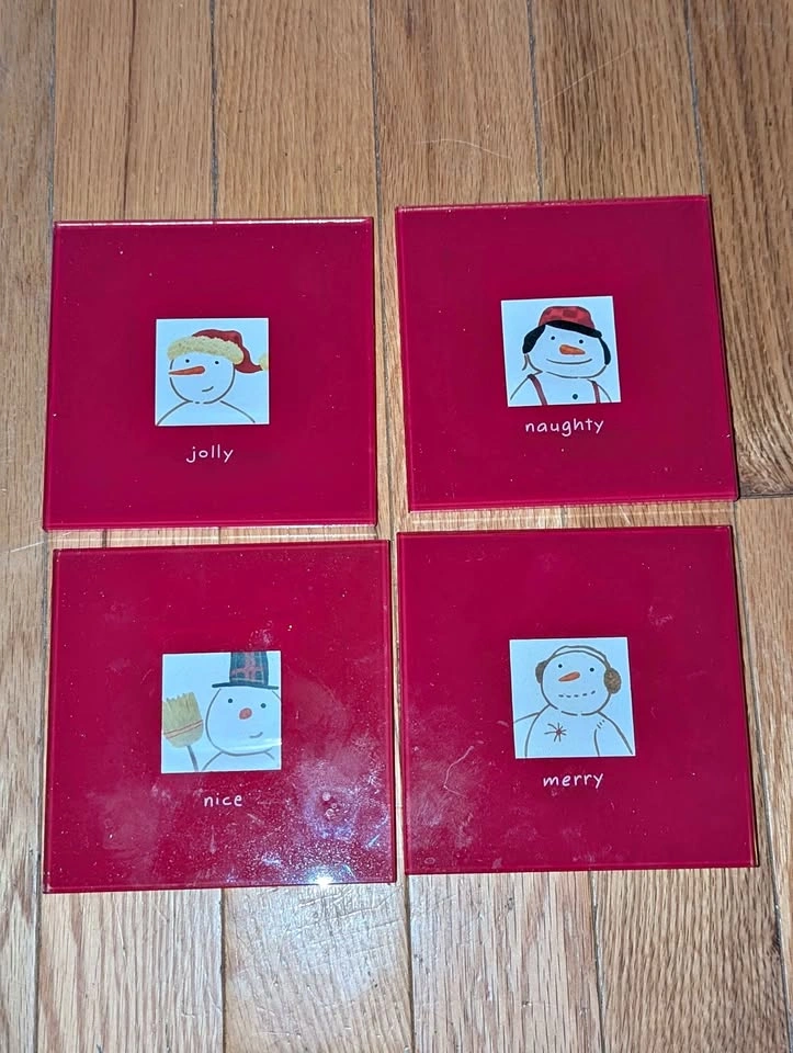 A set of 4 glass hallmark coasters